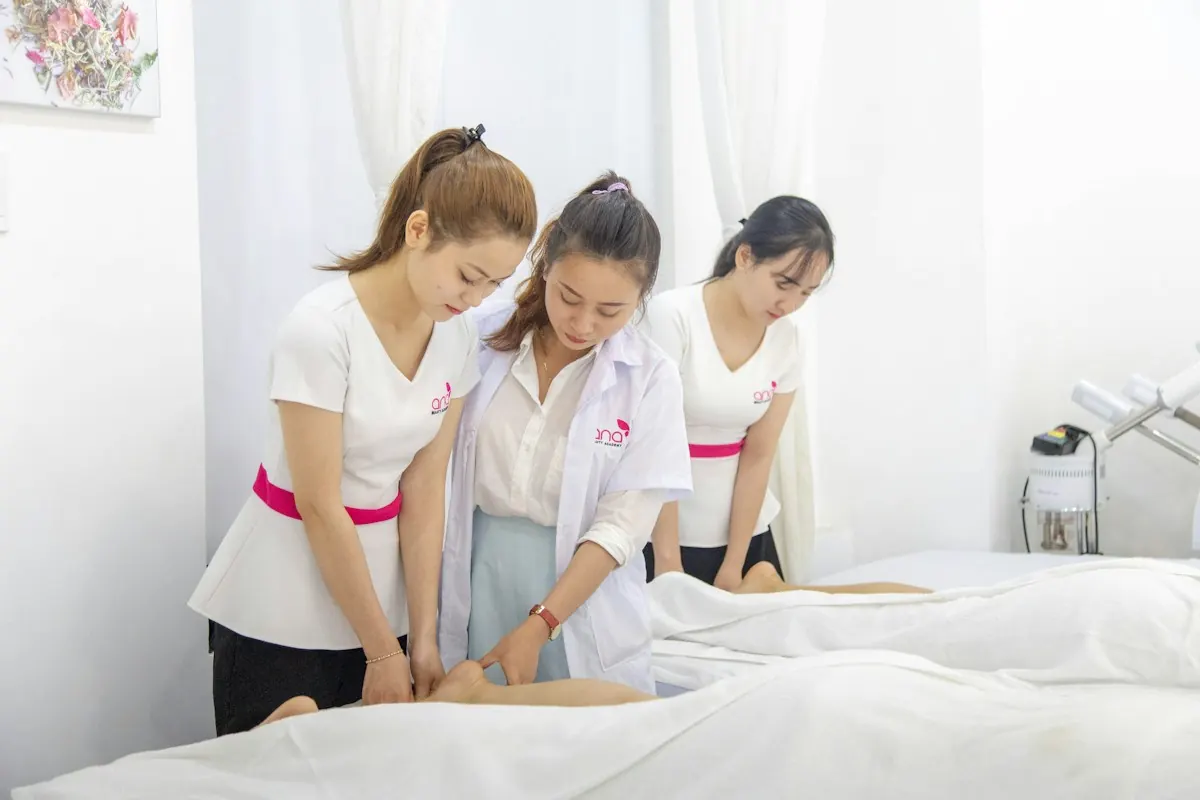 Spa therapists preparing a client for a treatment