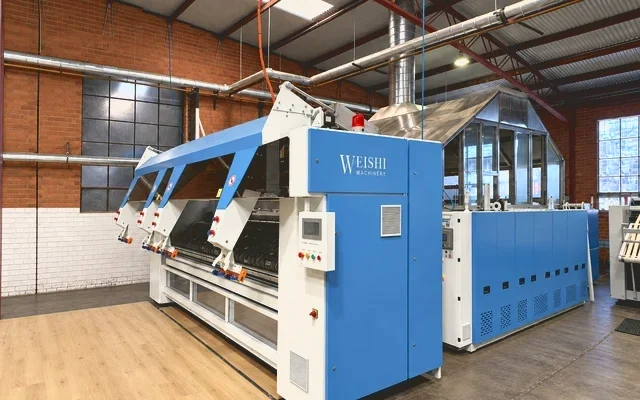 The flatwork ironing line running at the eWASH laundry in Moorabbin