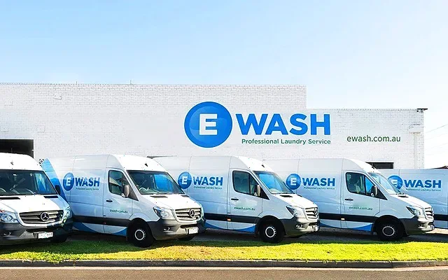 eWASH delivery vans lined up outside the Moorabbin laundry